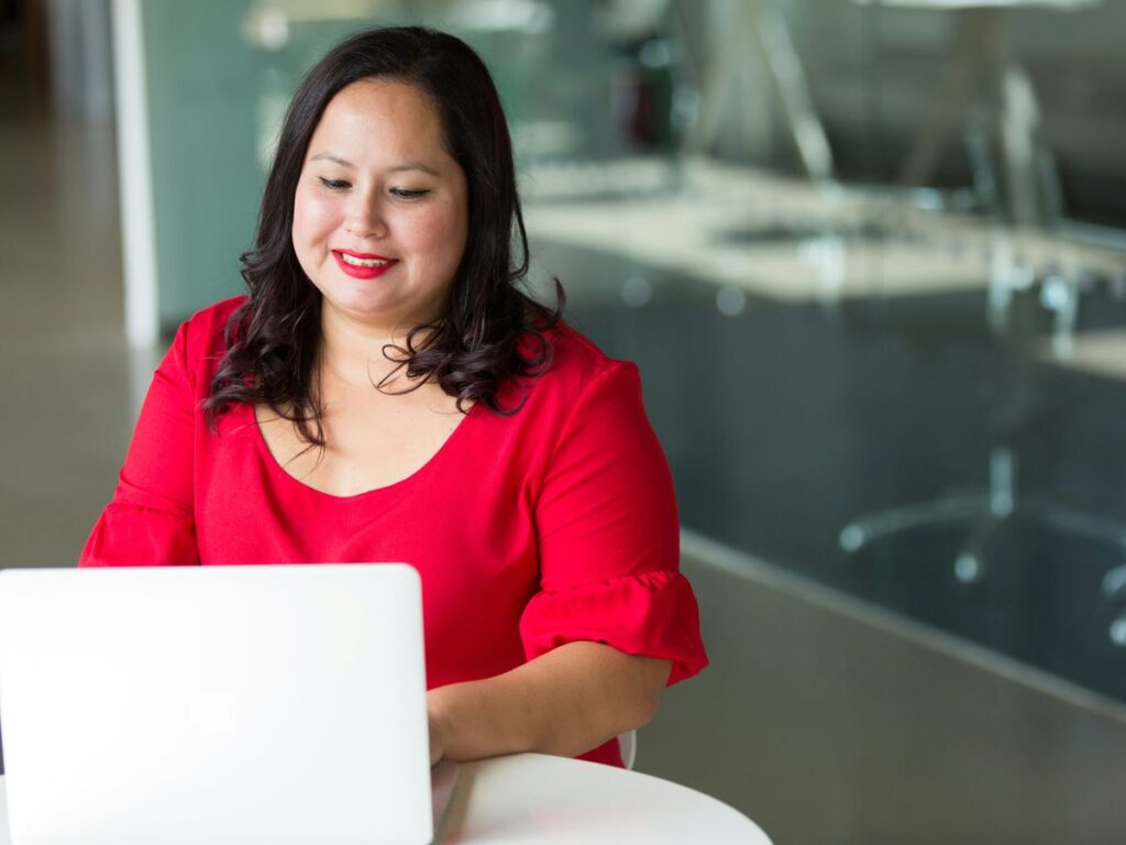 selective focus photography of woman using laptop computer